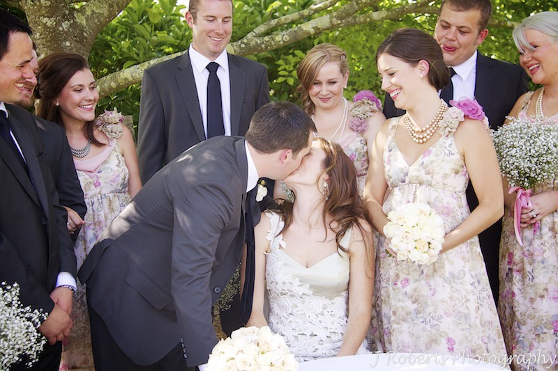 Bride and groom kiss after signing marriage register - wedding photography sydney